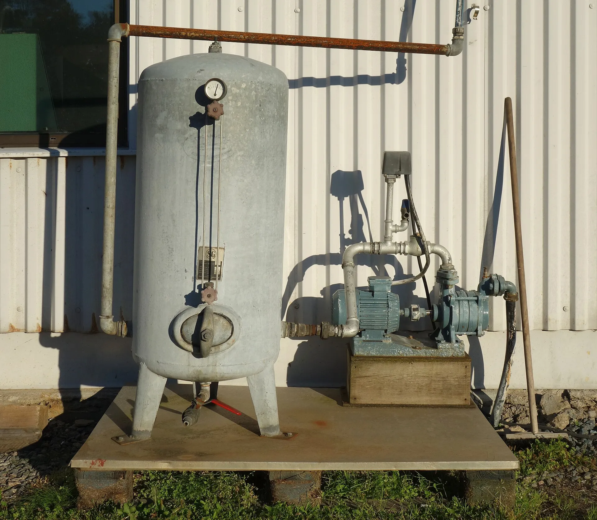 Well maintenance check on a wellhead and controls at a rural Hays County home